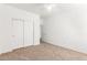 Carpeted bedroom featuring neutral walls, closet, and a ceiling fan at 1344 N Constellation Way, Gilbert, AZ 85234