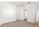 Bedroom with neutral carpet and walls and closet with sliding doors at 1344 N Constellation Way, Gilbert, AZ 85234