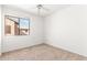 Bedroom with neutral carpet and walls with a view from the window at 1344 N Constellation Way, Gilbert, AZ 85234