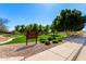 Inviting community park area with lush green grass, mature trees, and recreational amenities for outdoor enjoyment and relaxation at 1344 N Constellation Way, Gilbert, AZ 85234