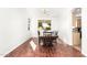 Dining area featuring a wood table, and hardwood floors at 1344 N Constellation Way, Gilbert, AZ 85234