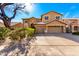 Charming two-story home featuring a spacious driveway, two-car garage, and mature landscaping at 1344 N Constellation Way, Gilbert, AZ 85234