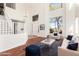 Open living room with vaulted ceiling, large windows and a staircase at 1344 N Constellation Way, Gilbert, AZ 85234