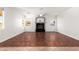 Bright living room featuring wood flooring, fireplace, and a ceiling fan at 1344 N Constellation Way, Gilbert, AZ 85234