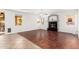Living room featuring a fireplace, hardwood floors, and natural light at 1344 N Constellation Way, Gilbert, AZ 85234