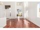Sunlit living room showcases hardwood floors and scenic views from large windows at 1344 N Constellation Way, Gilbert, AZ 85234