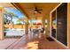 Covered patio features ceiling fans and outdoor dining with a view of the pool at 1344 N Constellation Way, Gilbert, AZ 85234