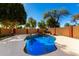 Backyard pool with rock waterfall feature and a private walled yard at 1344 N Constellation Way, Gilbert, AZ 85234