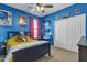 This bright and airy bedroom features a ceiling fan, posters, and a basketball hoop at 1391 E Angie St, Casa Grande, AZ 85122