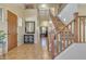 Grand foyer with high ceilings, staircase, tile flooring, and elegant decor for a welcoming entry at 1391 E Angie St, Casa Grande, AZ 85122