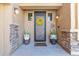 Inviting front porch with decorative wreath, potted plants, and seasonal decorations enhance the entryway at 1391 E Angie St, Casa Grande, AZ 85122