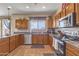 Fully equipped kitchen with stainless steel appliances and granite countertops providing ample workspace at 1391 E Angie St, Casa Grande, AZ 85122