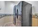 Modern laundry area equipped with a stacked washer-dryer and refrigerator at 1391 E Angie St, Casa Grande, AZ 85122
