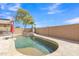 Backyard pool featuring a spa, palm trees, and a built-in umbrella stand at 1391 E Angie St, Casa Grande, AZ 85122