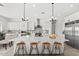 Spacious kitchen featuring a large island with seating, stainless steel appliances, and open layout at 13947 E Barwick Dr, Scottsdale, AZ 85262