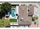 Aerial view of a home showcasing its large backyard pool, patio, and well-manicured landscaping at 1508 W Kiowa Ave, Mesa, AZ 85202