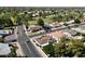 Aerial view of a neighborhood situated near a golf course with tree-lined streets and well-kept homes at 1508 W Kiowa Ave, Mesa, AZ 85202