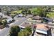 Aerial view of homes in a neighborhood near a golf course with mature trees and green spaces at 1508 W Kiowa Ave, Mesa, AZ 85202