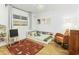 Bright bedroom showcasing a bed with built-in bookshelves and a comfy orange chair at 1508 W Kiowa Ave, Mesa, AZ 85202