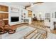 Open living area with stylish furniture, built-in shelving, and clear view to dining room at 1508 W Kiowa Ave, Mesa, AZ 85202