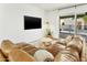 Cozy living room with a comfortable sofa, access to a pool, and modern lighting at 1508 W Kiowa Ave, Mesa, AZ 85202
