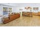 Spacious living room with modern decor, kitchen bar seating, and sliding glass doors to a pool at 1508 W Kiowa Ave, Mesa, AZ 85202