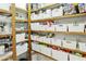Organized pantry with shelves, storage bins, and labeled containers for efficient food storage at 1508 W Kiowa Ave, Mesa, AZ 85202