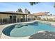 Backyard view of the refreshing pool, patio, and well-maintained exterior of this home at 1508 W Kiowa Ave, Mesa, AZ 85202