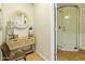Bright salon featuring a glass shower, wicker mirror and wood flooring at 1508 W Kiowa Ave, Mesa, AZ 85202