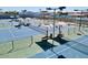 Upscale tennis courts with shade structures and blue playing surface provide luxury recreation at 1508 W Kiowa Ave, Mesa, AZ 85202