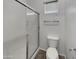 Bathroom featuring glass enclosed shower, toilet, blinds on window and towel rack at 15240 N 142Nd Ave # 2102, Surprise, AZ 85379
