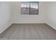 Neutral bedroom with large window providing natural light and carpeted flooring at 15240 N 142Nd Ave # 2102, Surprise, AZ 85379