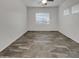 Bright bedroom featuring a ceiling fan and a large window with natural light at 15240 N 142Nd Ave # 2102, Surprise, AZ 85379
