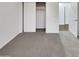 Cozy bedroom with plush carpeting and a closet for storage at 15240 N 142Nd Ave # 2102, Surprise, AZ 85379