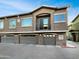 This is a three-story townhome with private garages and balcony in a modern desert community at 15240 N 142Nd Ave # 2102, Surprise, AZ 85379