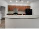 Well-equipped kitchen with an island, modern appliances, and plenty of cabinet space at 15240 N 142Nd Ave # 2102, Surprise, AZ 85379