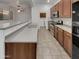This is a well-equipped kitchen featuring modern appliances and a convenient breakfast bar at 15240 N 142Nd Ave # 2102, Surprise, AZ 85379