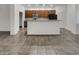 Spacious kitchen with ample countertop space, modern appliances, and stylish cabinetry at 15240 N 142Nd Ave # 2102, Surprise, AZ 85379