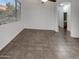 Bright living room featuring a large window for natural light and neutral wall colors at 15240 N 142Nd Ave # 2102, Surprise, AZ 85379