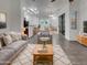 Open-concept living area with contemporary furnishings and decor, adjacent to the dining room at 15240 N 142Nd Ave # 2102, Surprise, AZ 85379