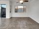 Open living area with a sliding glass door for natural light and outdoor access at 15240 N 142Nd Ave # 2102, Surprise, AZ 85379
