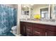 Bathroom features double sinks, granite countertops, and a shower-tub combination at 15856 N 76Th Ave, Peoria, AZ 85382