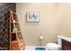 Stylish bathroom with modern fixtures, dark tile accent wall, and wood shelving at 15856 N 76Th Ave, Peoria, AZ 85382