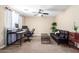 Versatile bedroom featuring a futon sofa and desk area, suitable for a home office or guest room at 15856 N 76Th Ave, Peoria, AZ 85382