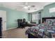 Bright bedroom features a ceiling fan, desk, and comfortable seating, perfect for a or teenager at 15856 N 76Th Ave, Peoria, AZ 85382