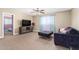 Cozy bedroom with neutral tones, comfortable seating, and a view of the adjacent room at 15856 N 76Th Ave, Peoria, AZ 85382