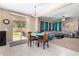 Bright dining area with sliding door access to the outdoor patio and backyard at 15856 N 76Th Ave, Peoria, AZ 85382