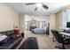 Cozy living room offers an open floor plan view into the main bedroom at 15856 N 76Th Ave, Peoria, AZ 85382