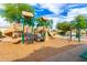 This neighborhood playground features modern slides, climbing structures, and other equipment at 15856 N 76Th Ave, Peoria, AZ 85382