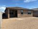 Expansive backyard featuring a covered patio area, perfect for outdoor entertaining and relaxation at 15989 W Cottontail Ln, Surprise, AZ 85387